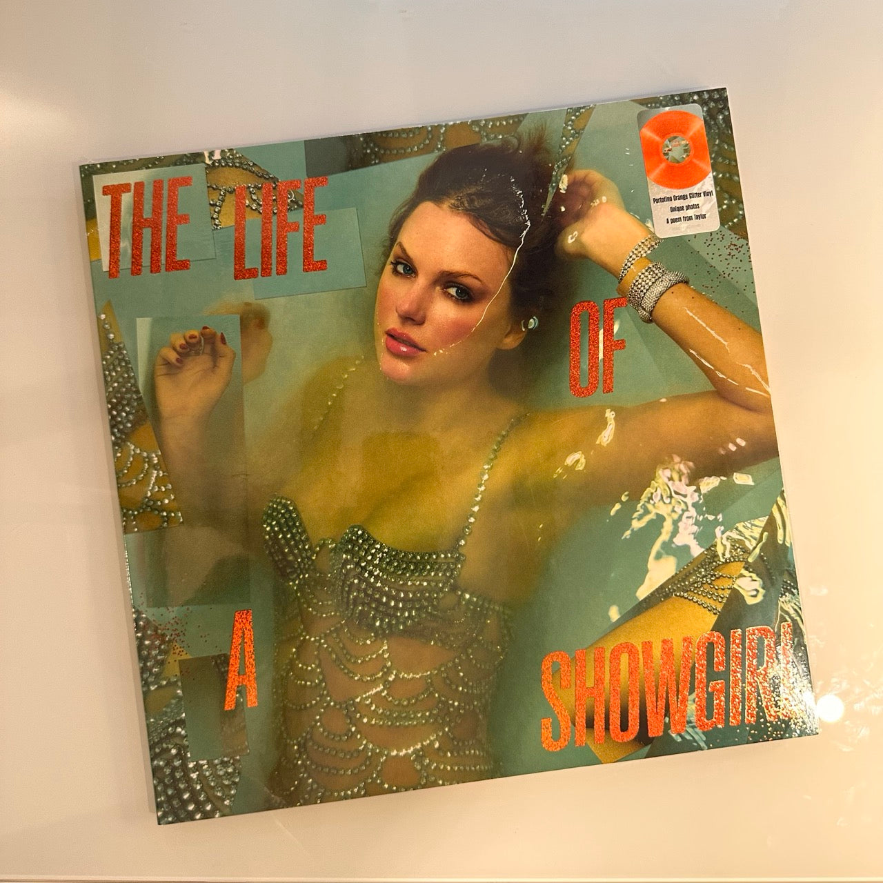 taylor swift life of a showgirl orange vinyl front cover