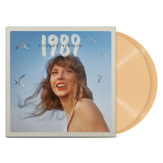 Vinyl record with a cover featuring a person and the text '1989 Taylor's Version' against a blue sky with seagulls.